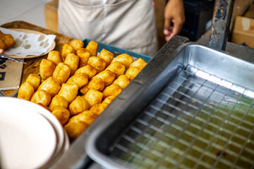 The background of the food menu includes boiled sea bass, pork leg rice, and delicious flavors while traveling.
