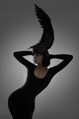Bird, fashion and art style woman in a studio with head piece, feather hat and abstract with unique...