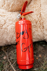 Red extinguisher ready for a thrilling gender reveal
