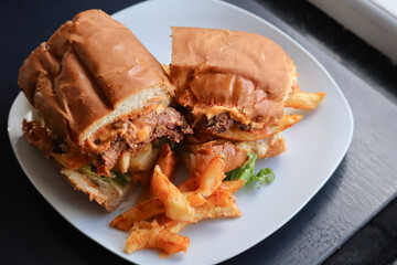 Masala steak Gatsby roll. South African fast food roll filled with hot chips, steak and braised onions.