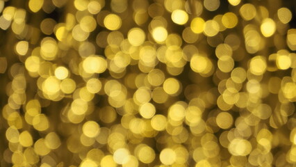 Obraz premium Bokeh images circle bubbles shape yellow color on black background.