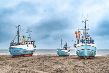 Thorup beach with active fishing vessels cutters, in Thy, Denmark