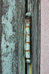 Old rusty copper door hinge.