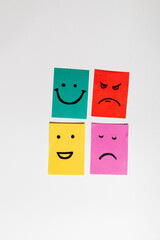 top view of paper cards with various smileys on white background, banner