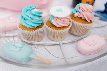 a Pastel cupcakes and popsicles on display for a celebration