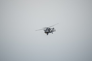 Fototapeta na wymiar British army AgustaWestland AW159 Wildcat AH1 helicopter in low level flight, Wilts UK
