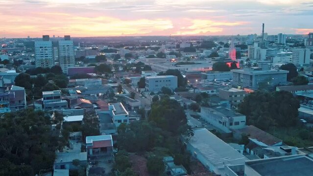 Aerial city scape at sunset with illuminated church in summer in central Cuiaba Mato Grosso