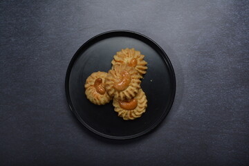 handmade baked luxury almond cashew nut butter quqi cookies and gold leaf plate fork knife on dark background pastry cafe dessert halal vegan party restaurant food gluten free menu