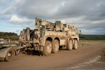 Obraz premium British army MAN SVR (Support Vehicle Recovery) 8x8 Truck pulling a trailer, Wiltshire UK