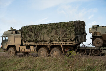 Obraz premium British army MAN HX58 6x6 Heavy Utility Truck EPLS in action on a military exercise