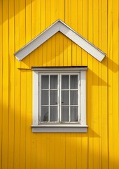 White window on yellow shingled wall. Typical colourful architecture. Space for your text.