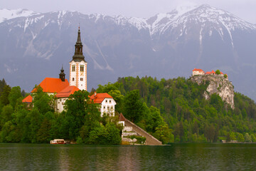 Beautiful mountain lake Bled . Pilgrimage Church of the Assumption of Maria situated on an island ....