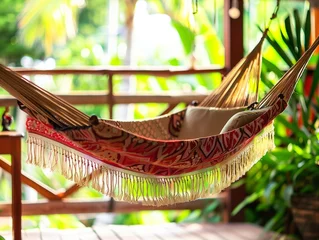 Poster Travel concept with a hammock in a tropical beach with turquoise water in the background © Svetlana