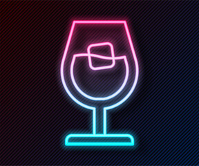 Glowing neon line Wine glass icon isolated on black background. Wineglass sign. Vector