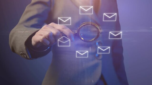 Cg footage. Silhouette of a woman in a business suit with a magnifying glass around which emails are rotating. A coordinate plane with moving numbers and words passes through the center. Fade lighting