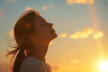 photo of woman looking up at sky with faith
