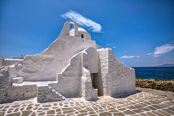 Famous traditional little church of Panagia Paraportiani, in Mykonos island, Greece - obrazy, fototapety, plakaty