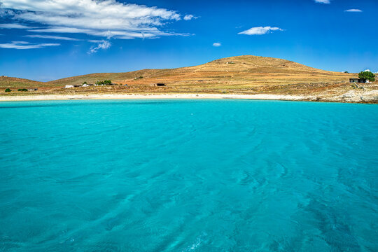 Bay in Rinia island, with clear transparent waters, Delos Mykonos Cyclades islands, Greece.