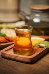 Glass of Tea on Wooden Cutting Board