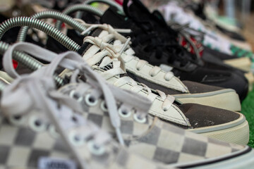 Photo of black and white checkered pattern shoes with white laces.