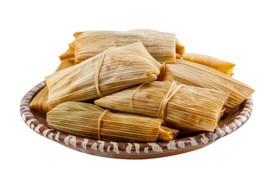 traditional Mexican tamales filled with savory pork and wrapped in corn husks, isolated on a clean white background.