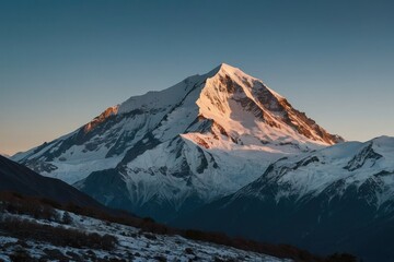 Fototapeta na wymiar snow capped mountain peaks in the early morning light