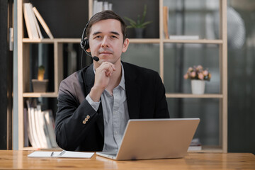 Handsome well dressed businessman working at his office, businessman working on a project