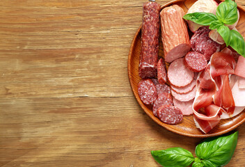 deli meats sausages ham salami on a wooden board