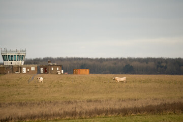 a small flight control tower on a countryside airfield