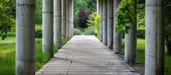 Modern concrete pillars create a stylish path.