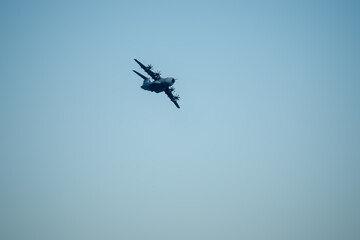 RAF Royal Air Force Airbus A400M Atlas military transport plane banking hard on a cargo parachute drop run over Wiltshire UK