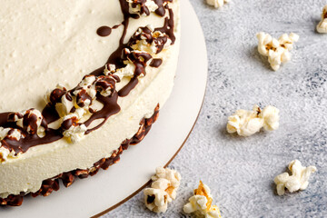 Cottage cheese cake with popcorn. Light background