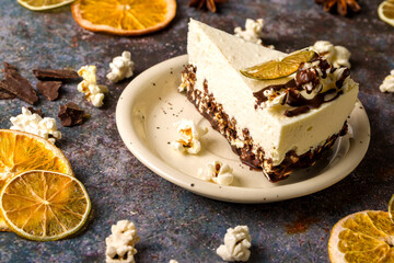 Cottage cheese cake with popcorn. Dark background