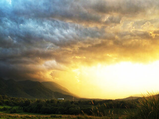 gold light cloundy and mountain