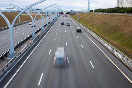 Horizontal image of a traffic with cars on the highway.