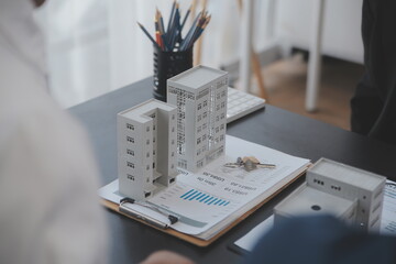Real estate agent and Sales manager team analysis pricing of rental lease contract of sale purchase...