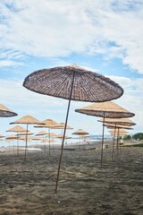 Sandy beach and beach umbrellas. Beach holidays