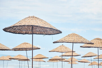 Sandy beach and beach umbrellas. Beach holidays