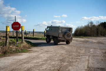 British army bae systems, Puch, Daimler, Pinzgauer High-Mobility All-Terrain 4x4 vehicle on a military battle exercise, Wilts UK © Martin