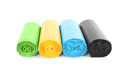 Rolls of colorful garbage bags isolated on white