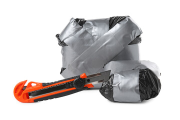 Packages with narcotics and stationery knife isolated on white