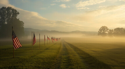 Obraz premium An early morning mist enveloping the field of flags, creating an ethereal and solemn atmosphere, Memorial Day, with copy space