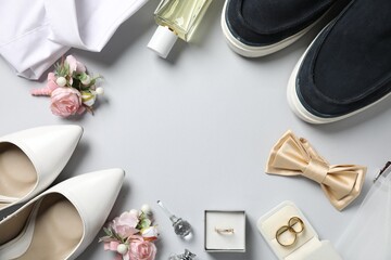 Wedding stuff. Flat lay composition with stylish boutonniere on light gray background, space for text - obrazy, fototapety, plakaty