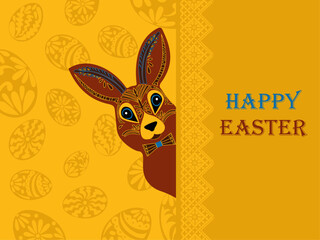 Easter. The rabbit looks out. Easter eggs silhouettes. Yellow background