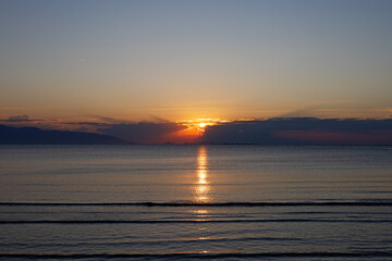 Glowing sunrise on a peaceful Mediterranean shore