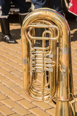 Tuba brass musical wind instrument outdoor at parade in sunny closeup