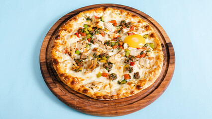 Vegetables pizza isolated on blue