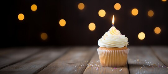 Panoramic of an appetizing cup cake with a candle.