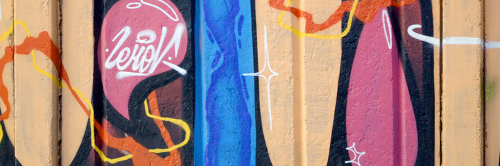 Colorful background of graffiti painting artwork with bright aerosol outlines on wall. Old school...