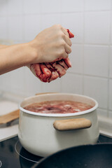 Cooking borsch on an induction stove in the kitchen